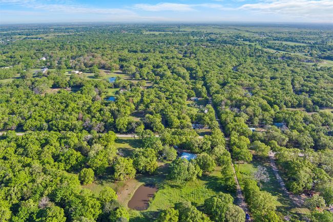 Aerial view featuring a wooded view | Image 38