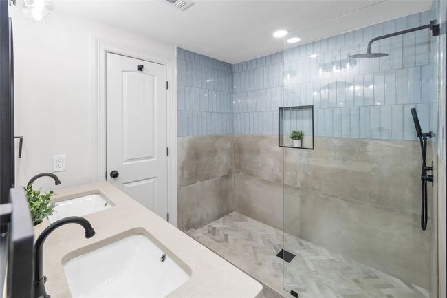 Full bath featuring a walk in shower, double vanity, and recessed lighting | Image 36
