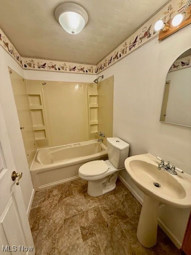 Unfinished below grade area with water heater and heating unit | Image 17
