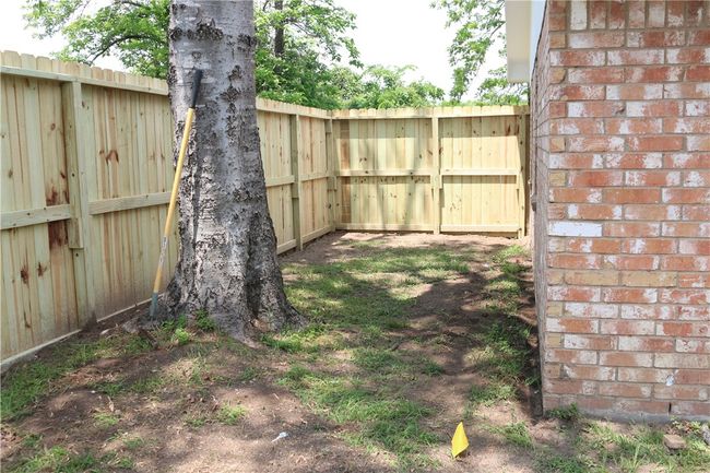 View of yard with fence | Image 4