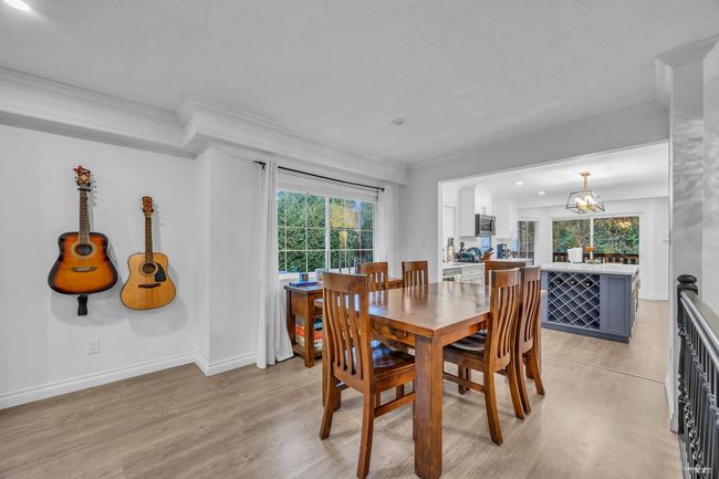 Dining space featuring crown molding, light wood-style flooring, and recessed lighting | Image 8