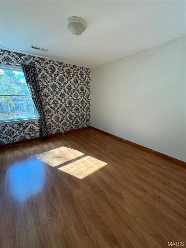 bedroom featuring dark wood-type flooring | Image 30