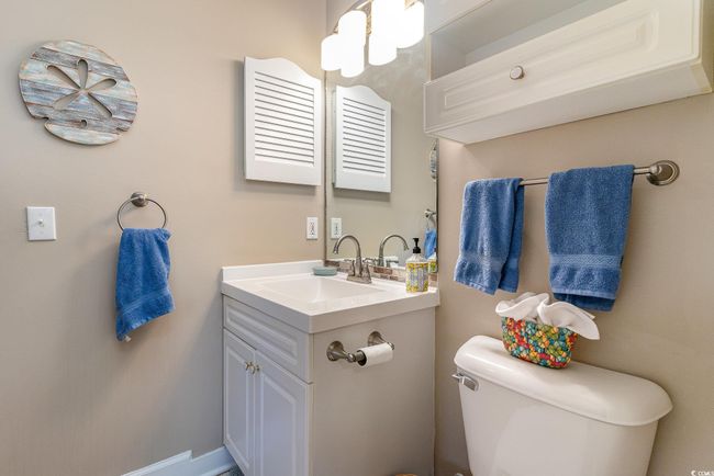 Bathroom featuring vanity and toilet | Image 15