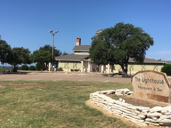 Lighthouse Pub with seating inside and outside. View a beautiful sunset. | Image 18