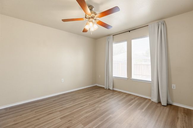 Spare room with light wood-style floors and ceiling fan | Image 17