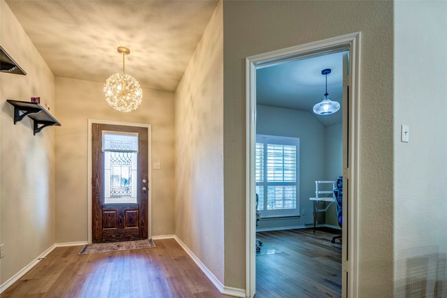 Entryway with a chandelier, wood finished floors, and plenty of natural light | Image 4