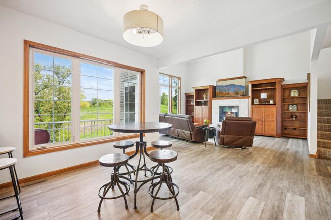 The main level features soaring vaulted ceilings and an abundance of windows that flood the space with natural light | Image 17