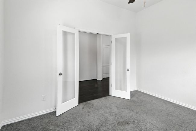 Unfurnished bedroom featuring carpet flooring and ceiling fan | Image 9