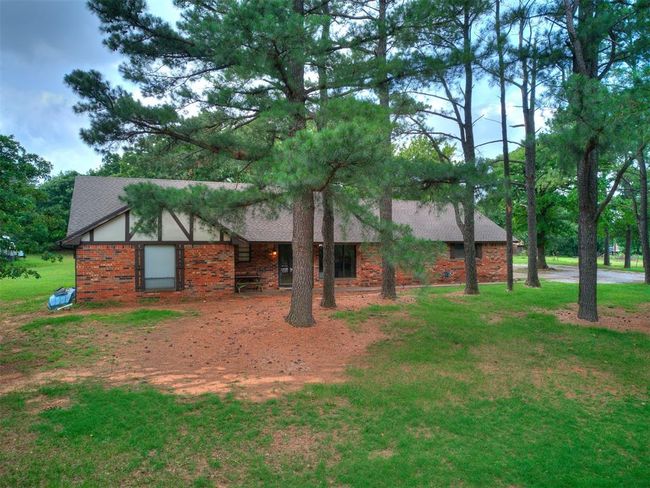 View of front facade featuring brick siding and a front yard | Image 26