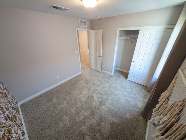 Unfurnished bedroom with carpet flooring and a closet | Image 35