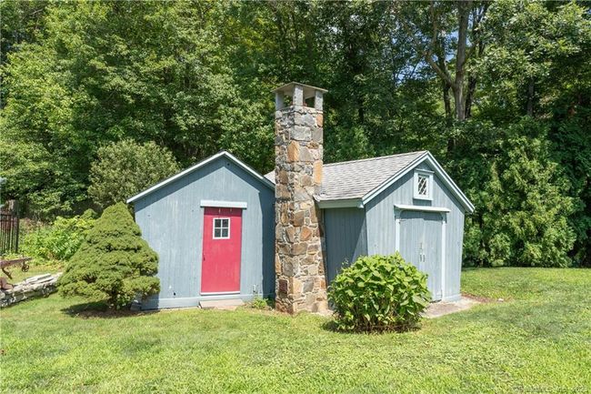 The stunning fieldstone chimney stack in the Corn Cribs was made to allow a wood stove to be used. | Image 26