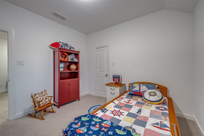 Bedroom featuring visible vents, baseboards, and light colored carpet | Image 25