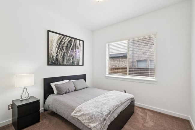 Bedroom with carpet and baseboards | Image 18