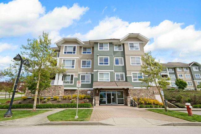 View of building exterior with decorative driveway | Image 29