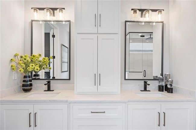 Primary Bathroom with dual vanities, soaker tub and large shower. | Image 23