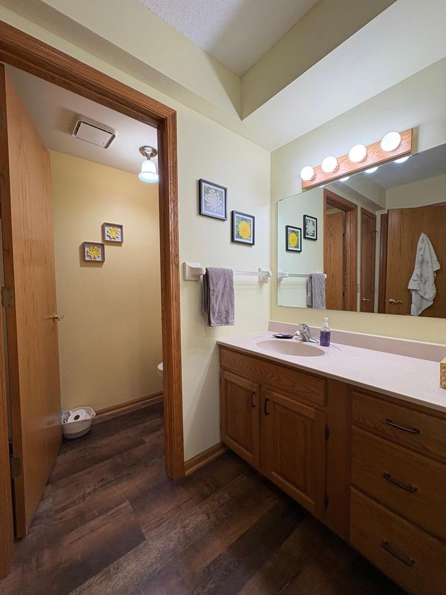 main floor bath vanity and door into toilet closet | Image 23