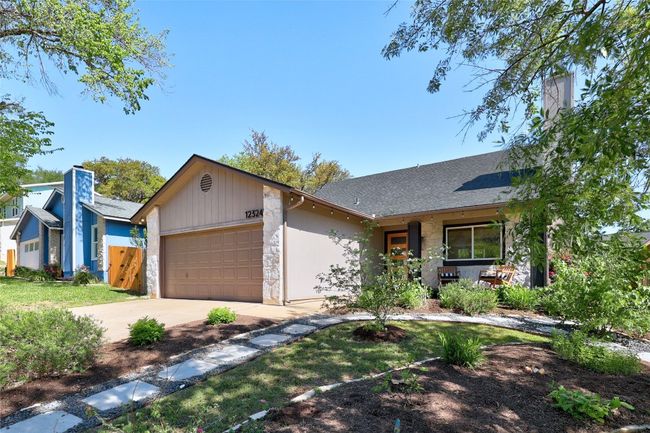 Great curb appeal with landscaping, mature trees and covered porch | Image 4