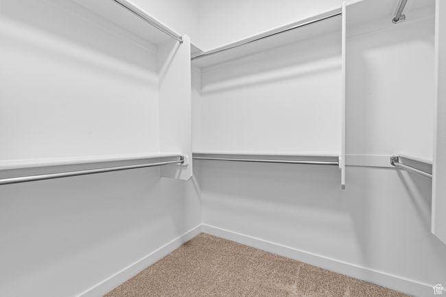 Spacious closet with carpet floors | Image 17