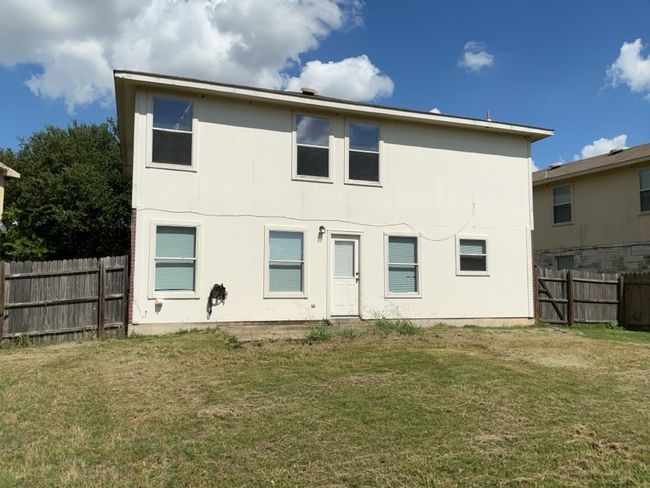 Back of house with a fenced backyard and stucco siding | Image 26