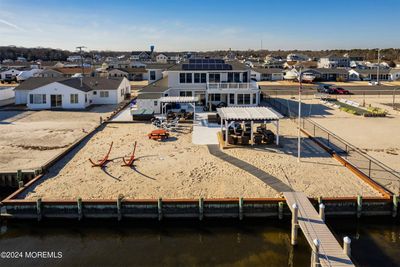 View of the Home From the Bay Featuring 2 Pergolas | Image 1