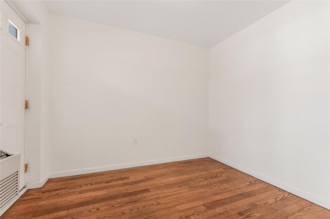 Empty room featuring light wood-type flooring and baseboards | Image 9
