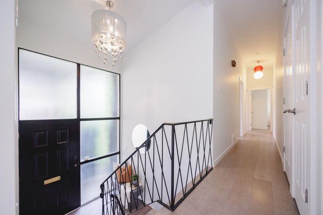 Entrance foyer featuring a chandelier | Image 13