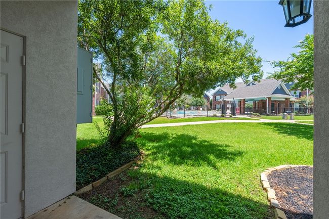 View of greenbelt leading to community pool | Image 13