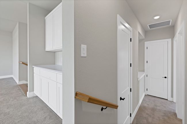 Corridor with light carpet and recessed lighting | Image 25