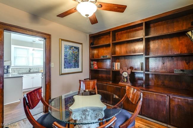 Office space featuring wood finished floors and a ceiling fan | Image 12