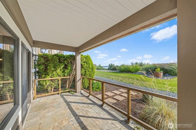 Covered patio to enjoy views and sunsets year round. | Image 7