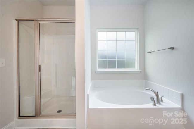 Ensuite Bathroom w/Stand Alone Shower and Obscured Window by Sunken Tub | Image 17