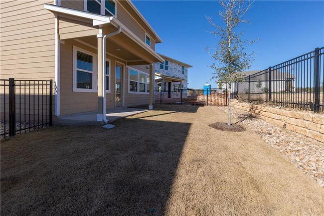 Fenced backyard featuring a patio area | Image 13