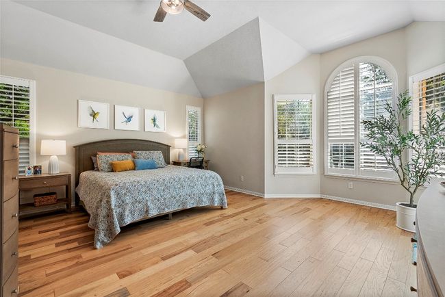 The primary bedroom feels like a personal retreat, with expansive windows that not only fill the room with light but also offer peaceful, elevated views | Image 18