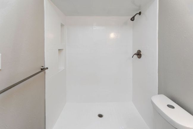 Shower with vanity and wood finished floors | Image 20