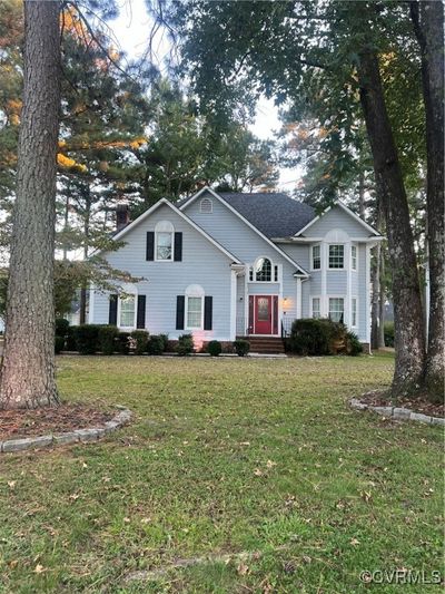 View of front of property with a front yard | Image 1