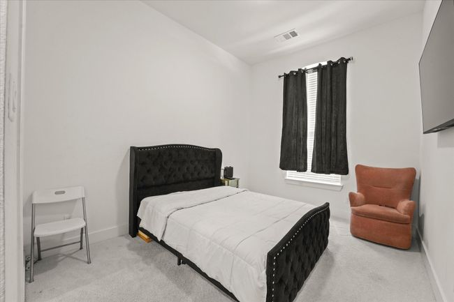 Bedroom with carpet flooring | Image 23