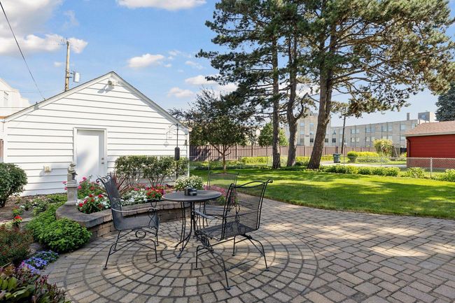 Catch a breeze on paver patio | Image 32