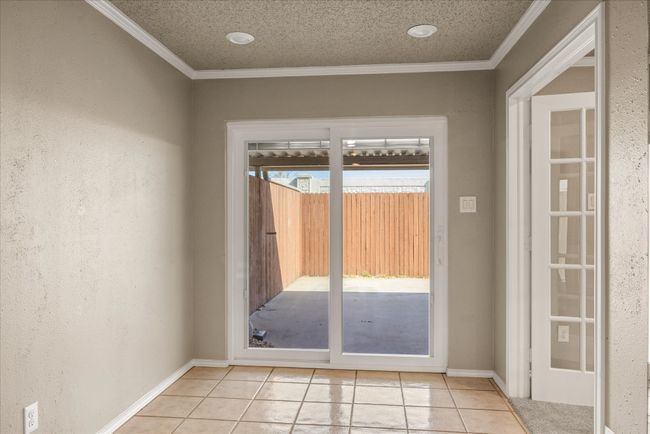 Dining area which opens to the large back courtyard. | Image 16