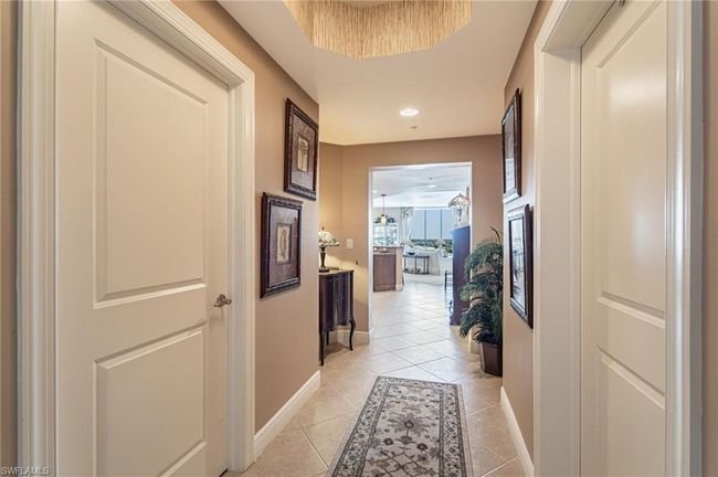 Hallway featuring light tile patterned floors | Image 9