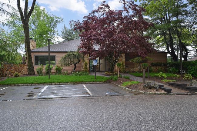 View of front of home with uncovered parking and a chimney | Image 21