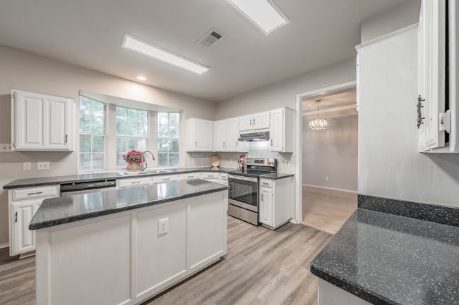 Bay window in kitchen offers plenty of natural light & great place for growing herbs. | Image 14