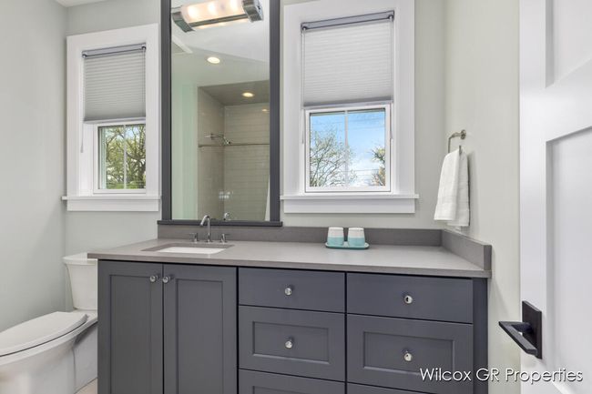 Bathroom #2 features, custom vanity with quartz counters, tile flooring and loads of natural light. | Image 30