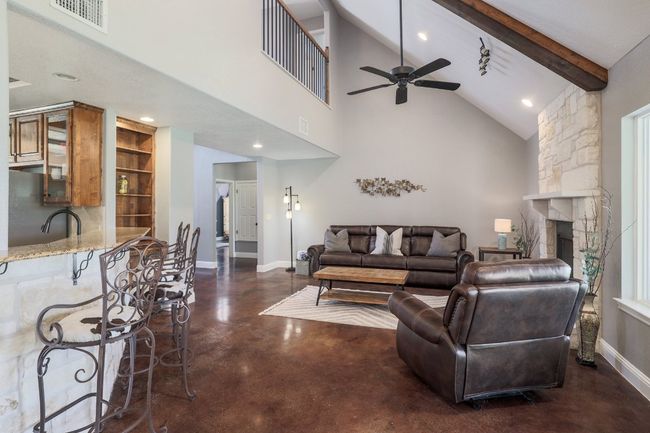 Kitchen open to living room. | Image 8