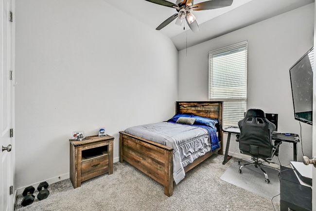 The spacious guest bedrooms offer plenty of room for rest and relaxation, each featuring large windows that fill the room with natural light. | Image 18