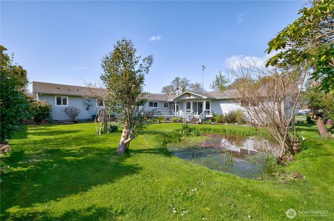 Fully fenced and landscaped back yard and small pond. | Image 39