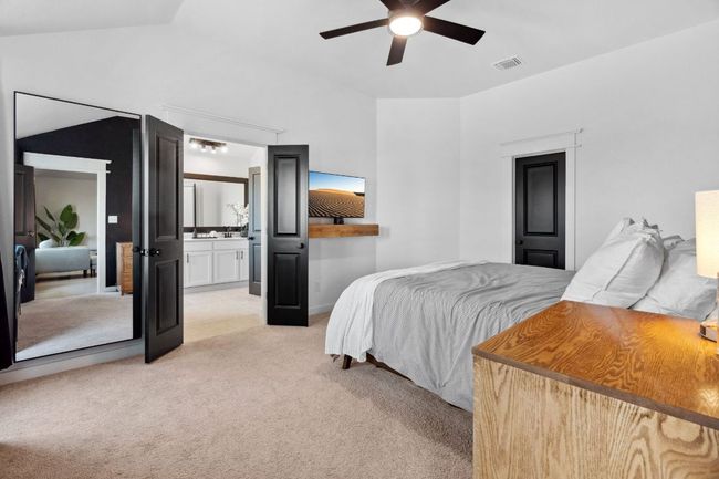 French doors guide you to the luxurious ensuite bathroom. | Image 20