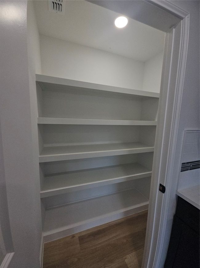 Storage area featuring visible vents | Image 7