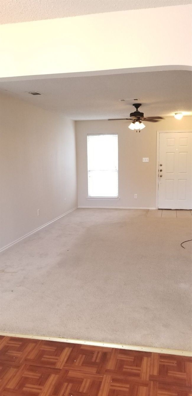 Empty room featuring a ceiling fan and baseboards | Image 8