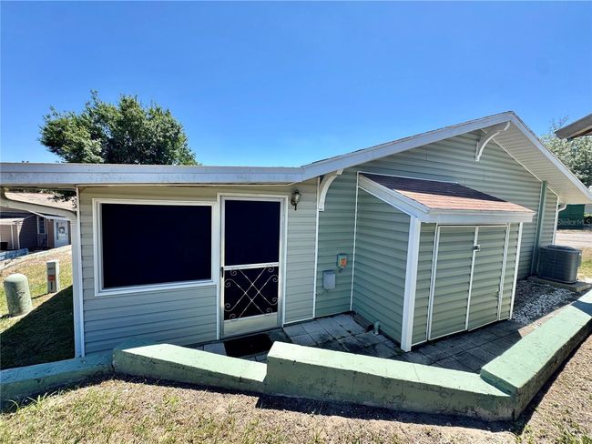 View of back screened in porch and the "bump out" area is where the washer and dryer hook ups are | Image 26