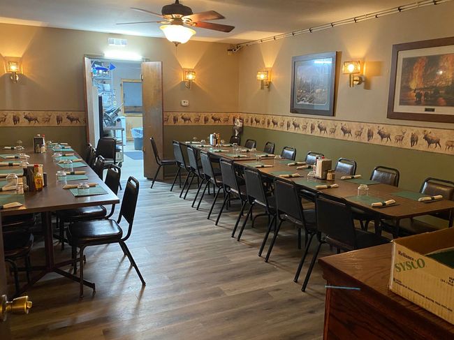 Dining room with ceiling fan, visible vents, and wood finished floors | Image 6